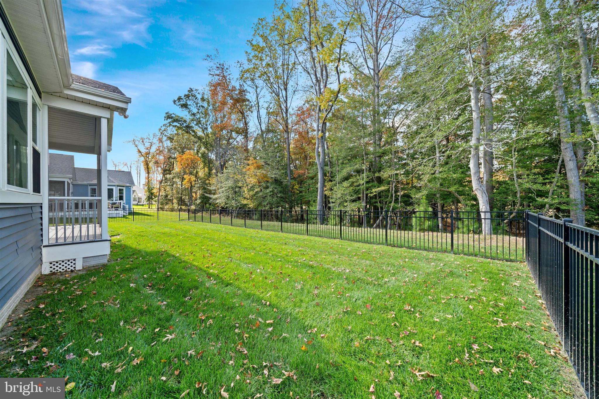 22144 Welches Way Lewes, DE 19958 - Photo 67 of 77 a view of a house with a yard and a tree