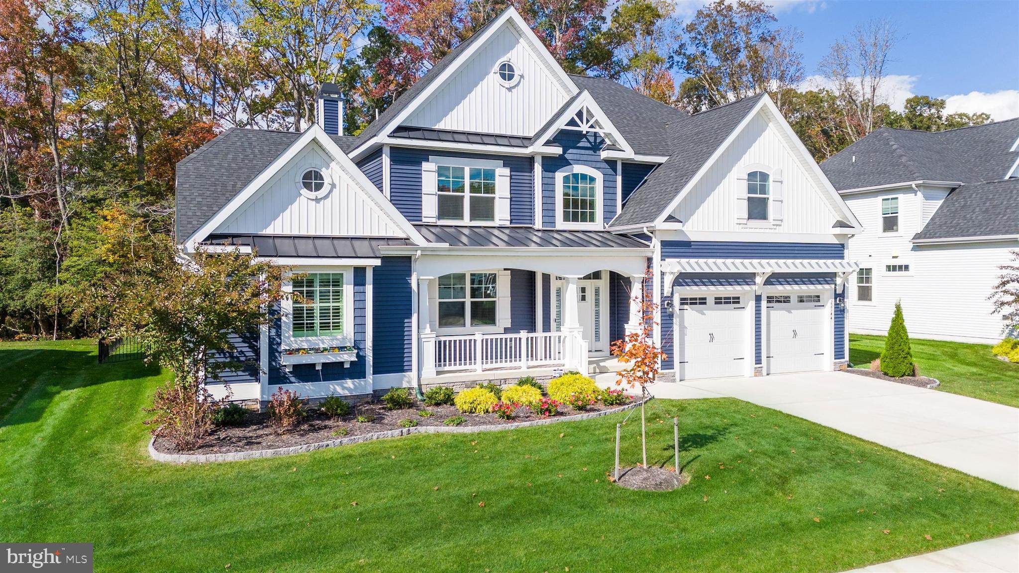 22144 Welches Way Lewes, DE 19958 - Photo 76 of 77 a front view of house with yard and green space