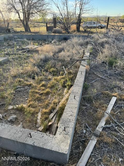 460 4th Street Wadsworth, NV 89442 - Photo 7 of 8 a view of a yard with wooden fence