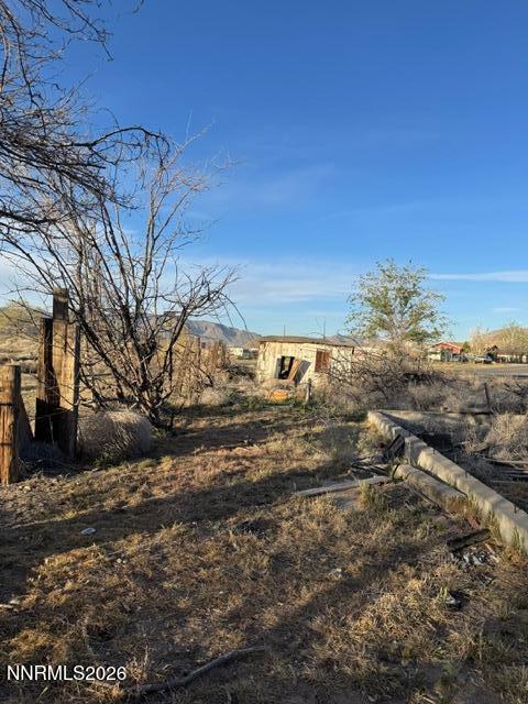 460 4th Street Wadsworth, NV 89442 - Photo 8 of 8 a view of a yard with wooden fence