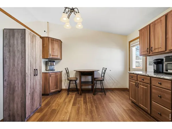 a view of kitchen and dining room with wooden floor