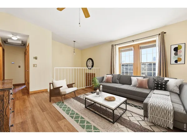 a living room with furniture and a table