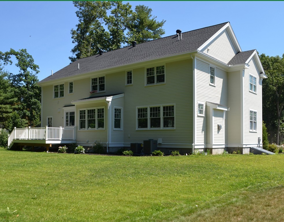 Lot 7 Monsen Road Concord, MA 01742 - Photo 2 of 8 a front view of a house with a yard
