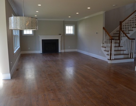 Lot 7 Monsen Road Concord, MA 01742 - Photo 3 of 8 an empty room with wooden floor fireplace and windows