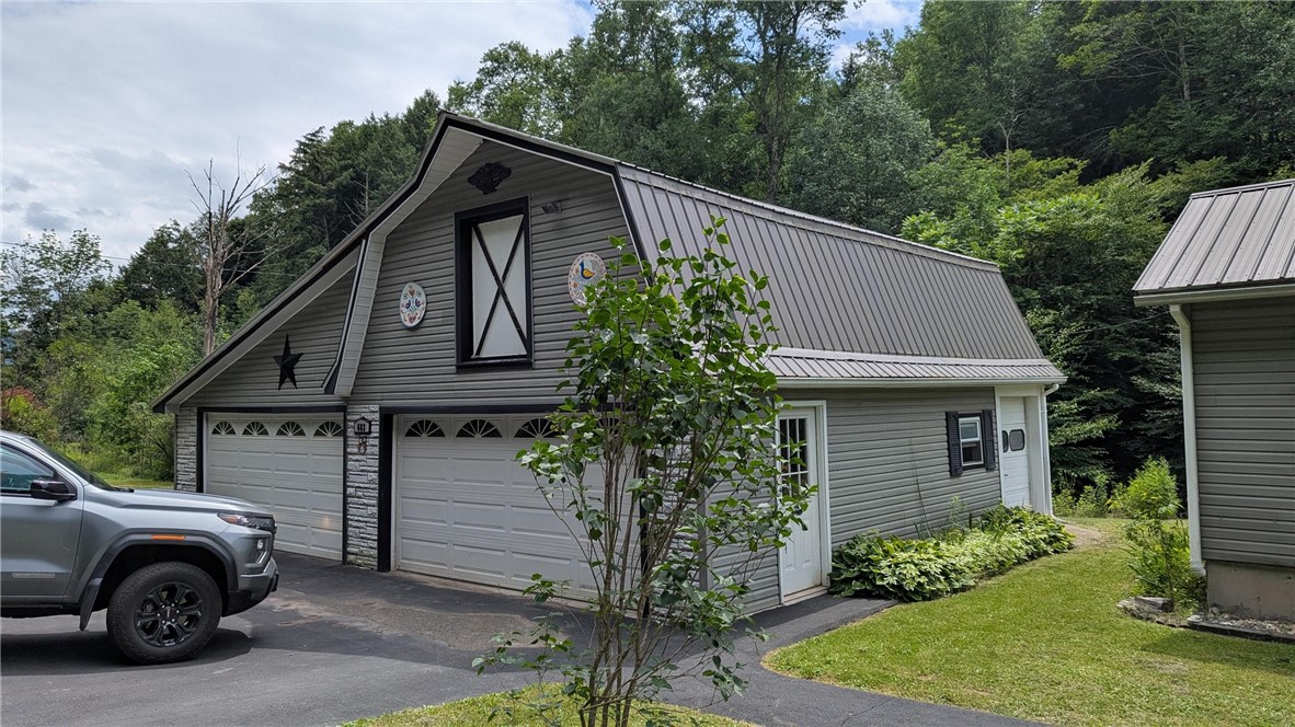 683 Lower 3rd Brook Road Walton, NY 13856 - Photo 4 of 27 Amazing 2 car + garage has multiple overhead doors for your convenience, heat and electric , upper storage.