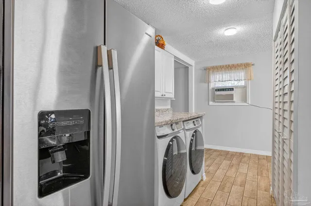 a kitchen with granite countertop a stove and a sink