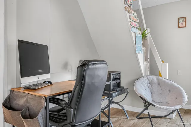 a view of dining room with furniture and a window