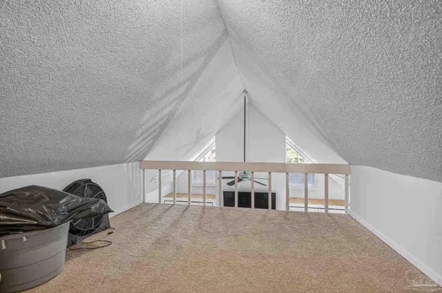 a kitchen with granite countertop a refrigerator stove and microwave