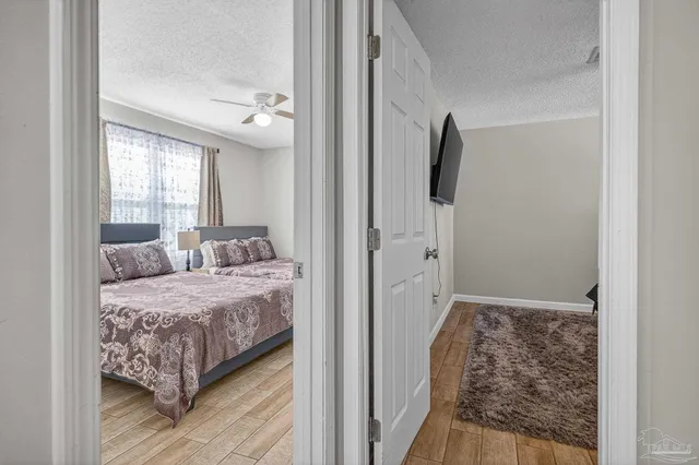 a bedroom with a large bed and a window