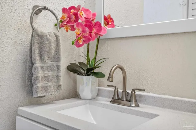 a view of a garden with a building in the background