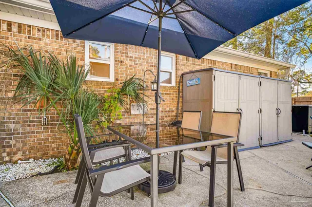 a view of a house with swimming pool yard and sitting area