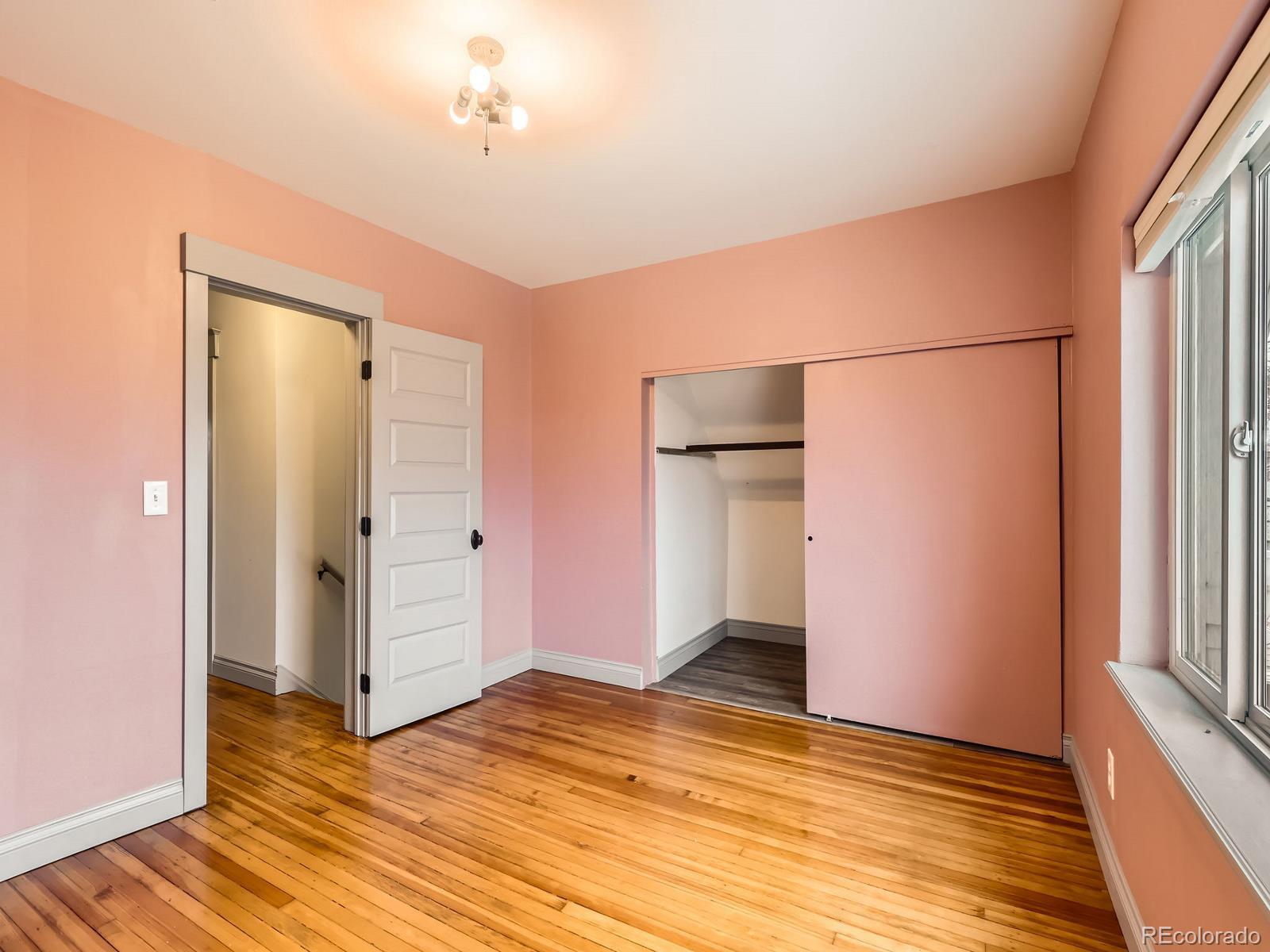 3833 Umatilla Street Denver, CO 80211 - Photo 31 of 50 a view of empty room with wooden floor and fan