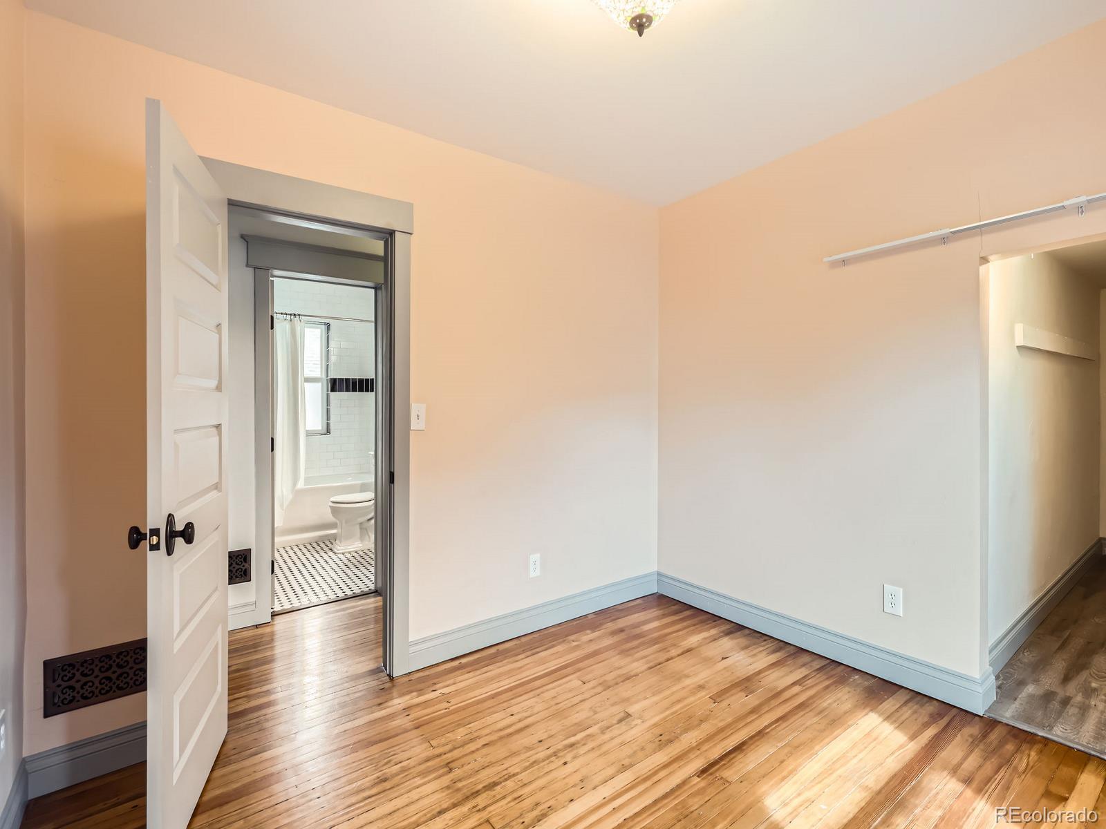 3833 Umatilla Street Denver, CO 80211 - Photo 33 of 50 a view of a room with wooden floor and a bathroom
