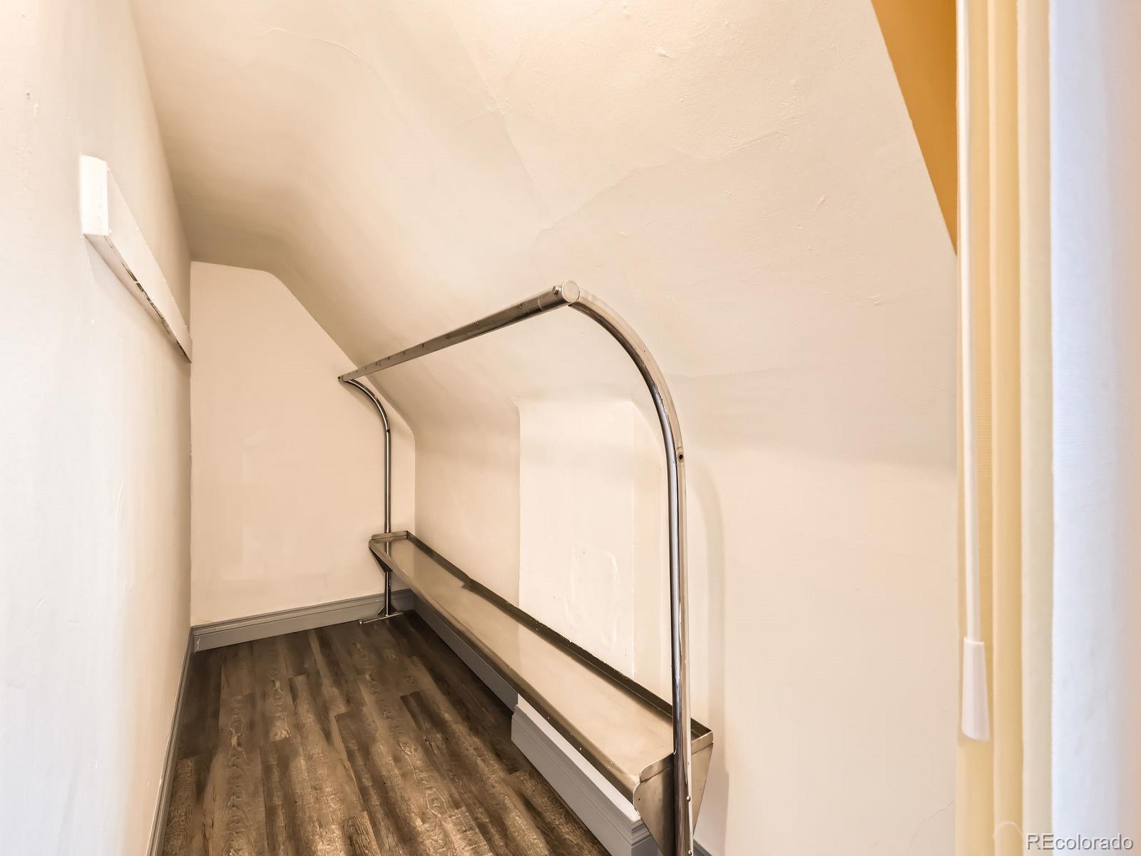 3833 Umatilla Street Denver, CO 80211 - Photo 35 of 50 a view of a room with wooden floor and a window