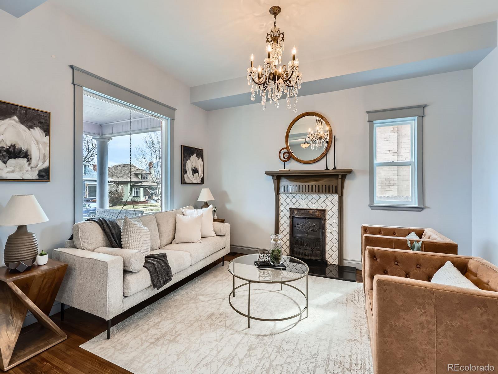 3833 Umatilla Street Denver, CO 80211 - Photo 9 of 50 a living room with furniture chandelier and a fireplace