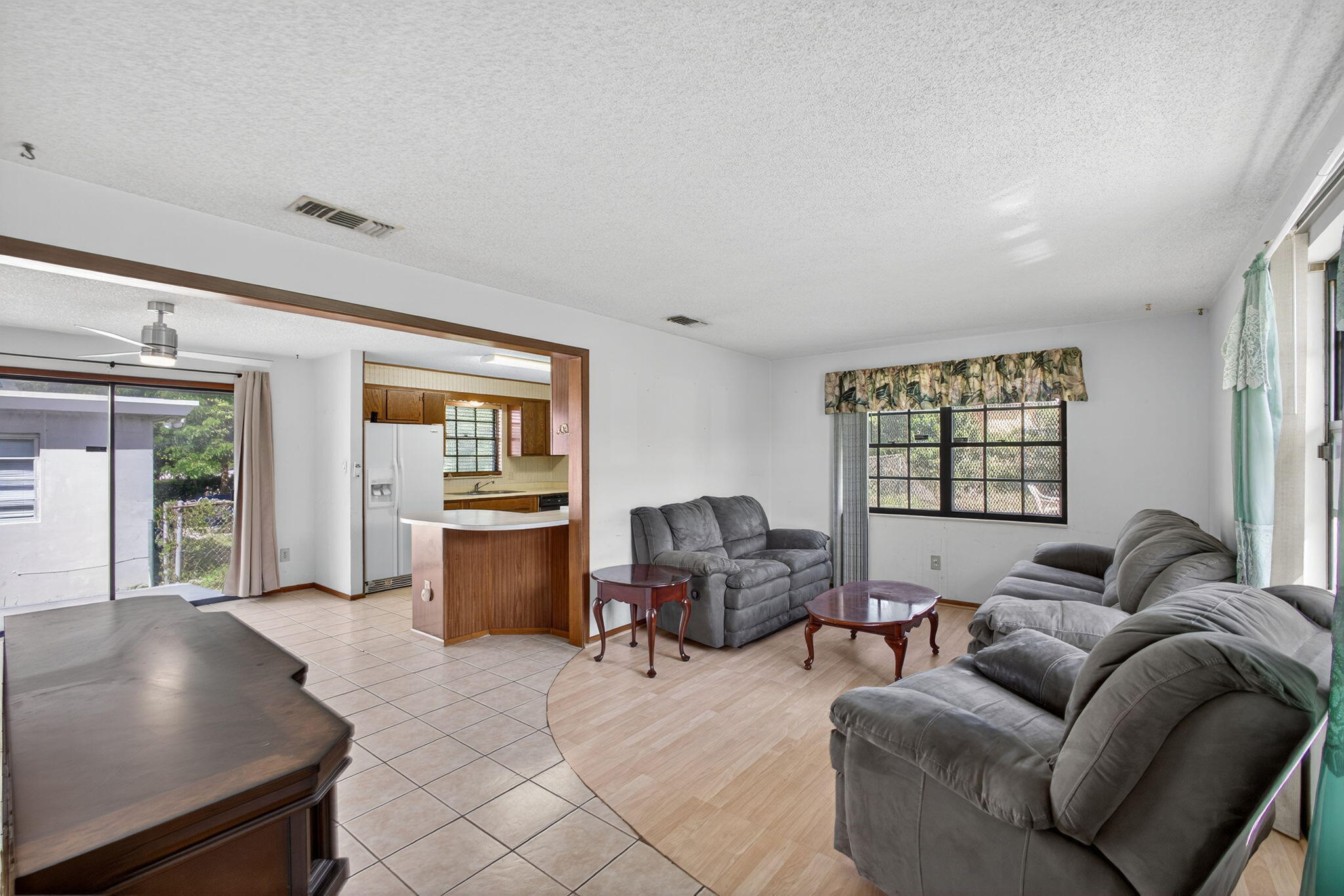 1332 West 33rd Street Riviera Beach, FL 33404 - Photo 1 of 25 a living room with furniture and a window