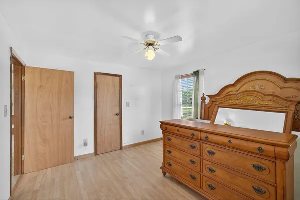 a room with bed and window