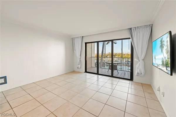 a view of an empty room with windows