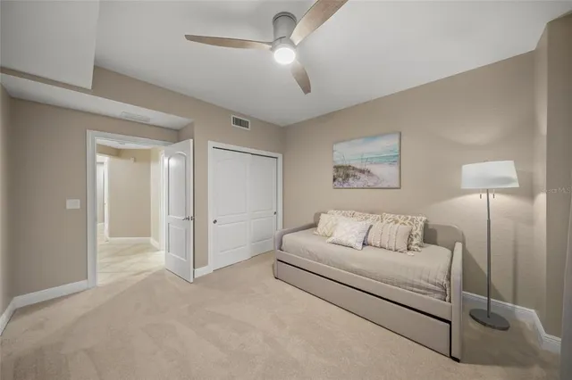 a living room with furniture and a lamp