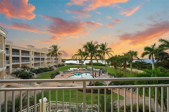 a living room with furniture a floor to ceiling window and a ceiling fan