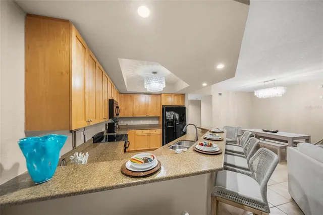 a kitchen with a table and chairs