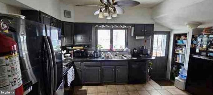 264 Birch Street Penns Grove, NJ 08069 - Photo 6 of 8 a kitchen with a refrigerator and a sink