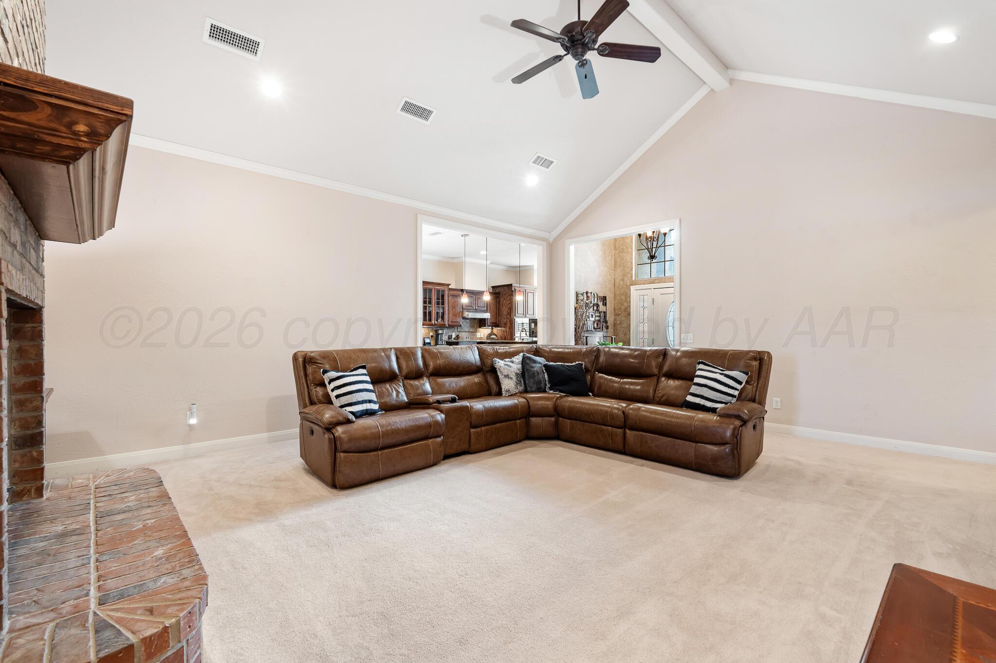 5008 Wesley Road Amarillo, TX 79119 - Photo 6 of 47 a living room with furniture and a flat screen tv