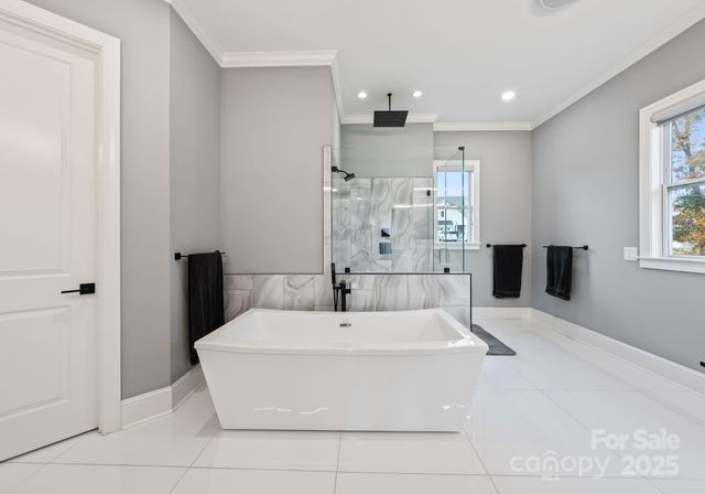 a bathroom with a bathtub and a sink