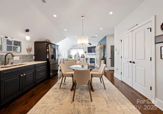 a large kitchen with a table and chairs
