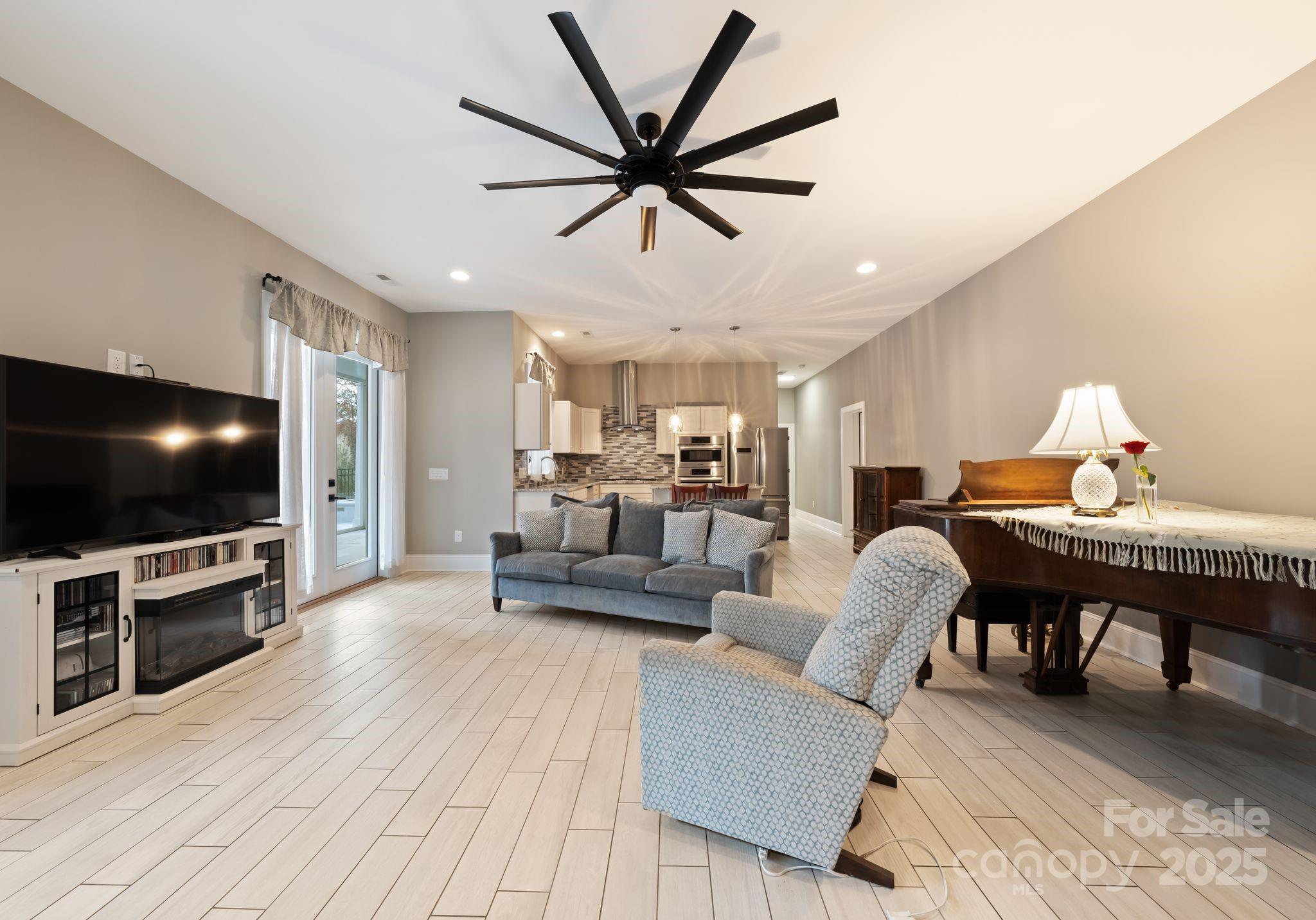 16312 Cozy Cove Road Charlotte, NC 28278 - Photo 29 of 48 a living room with furniture and a flat screen tv