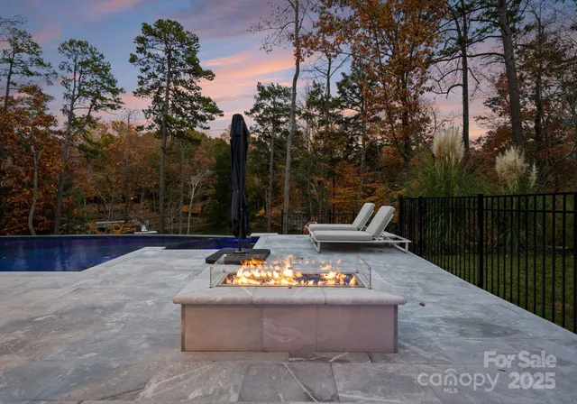 a view of swimming pool with patio