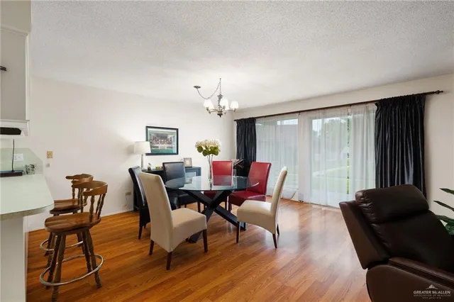 a view of a dining room with furniture and window