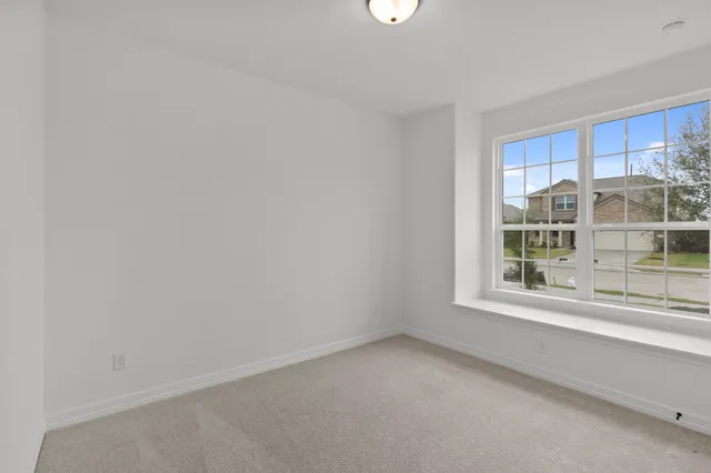 a view of empty room with windows