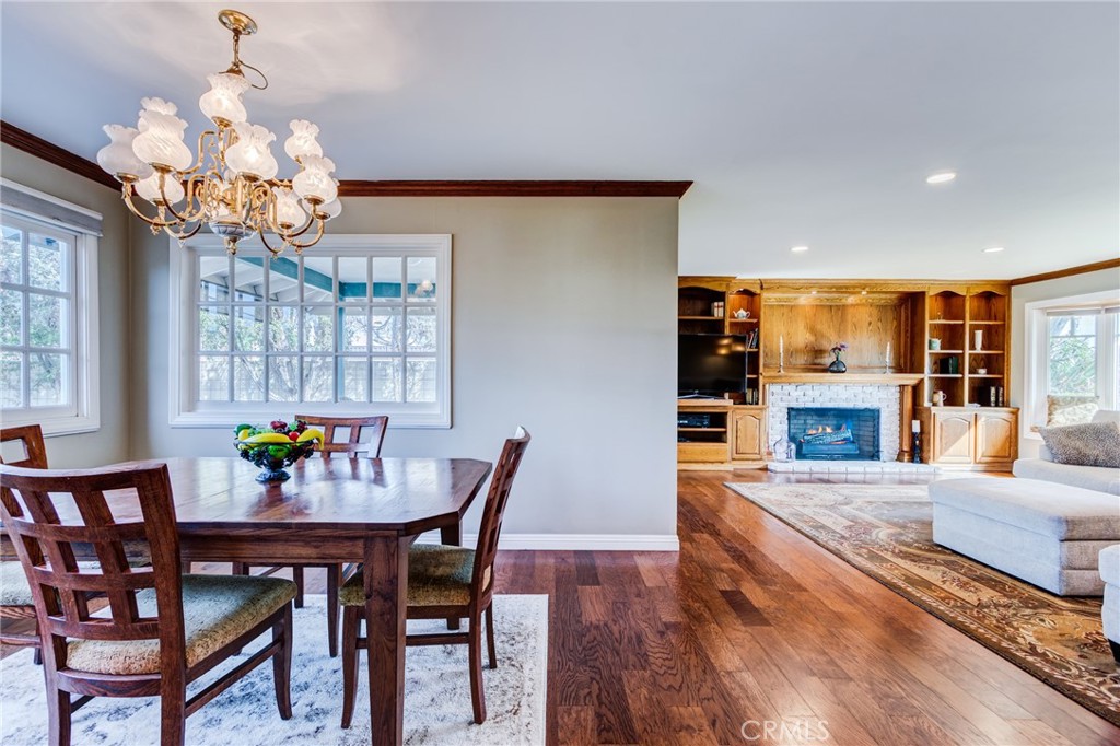 2757 Puente Street Fullerton, CA 92835 - Photo 18 of 71 a view of a dining room with furniture a chandelier and wooden floor