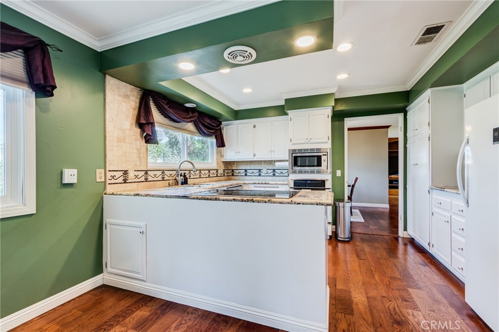 2757 Puente Street Fullerton, CA 92835 - Photo 21 of 71 a kitchen with stainless steel appliances granite countertop a refrigerator a sink and a stove
