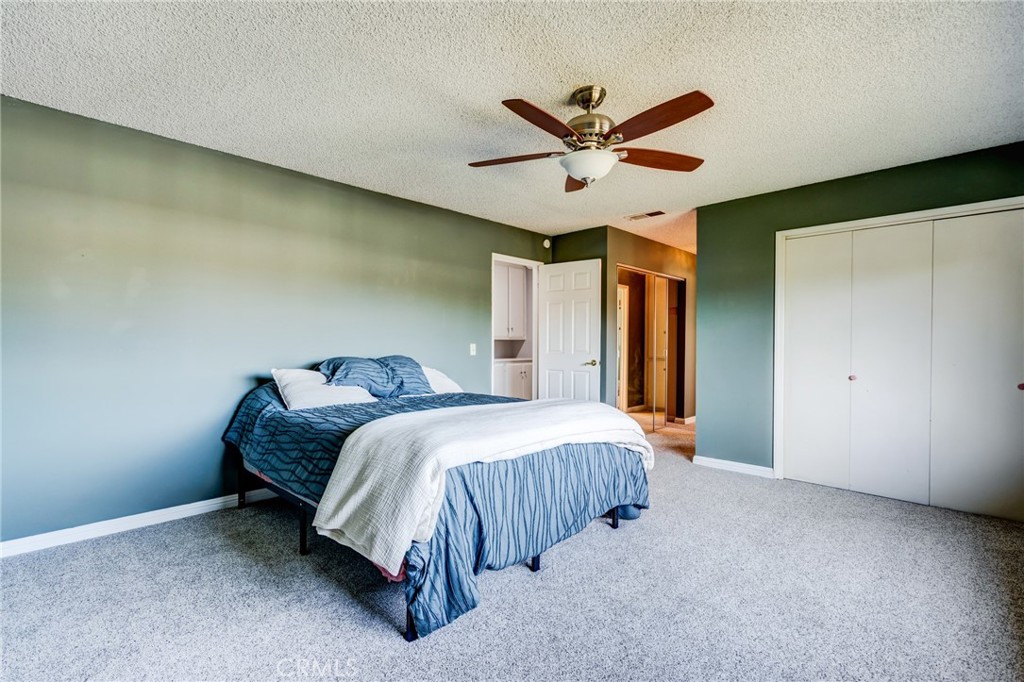 2757 Puente Street Fullerton, CA 92835 - Photo 32 of 71 a bedroom with a bed and a ceiling fan