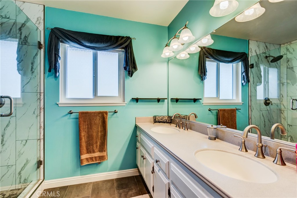 2757 Puente Street Fullerton, CA 92835 - Photo 35 of 71 a bathroom with a double vanity sink and a mirror