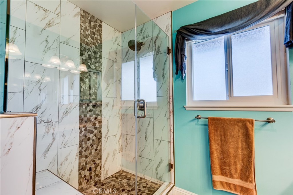 2757 Puente Street Fullerton, CA 92835 - Photo 36 of 71 a bathroom with a shower and a sink