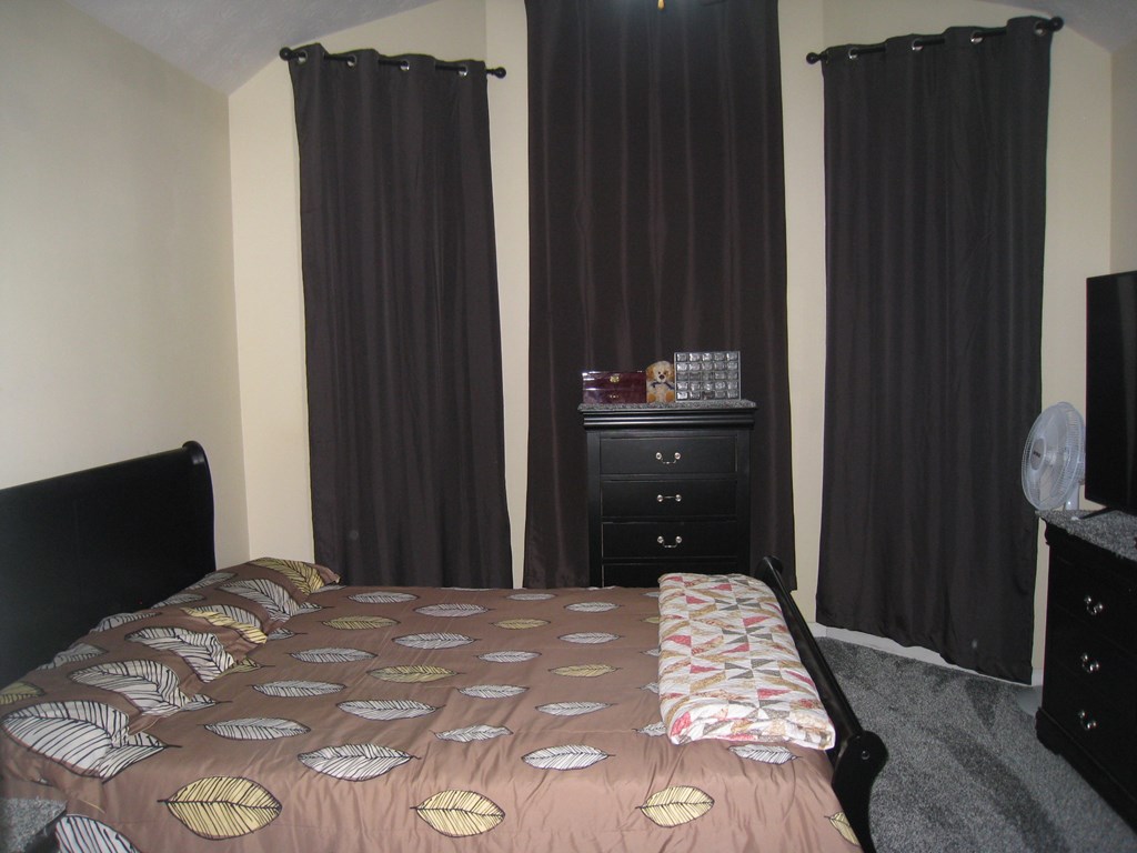 3007 Alamo Court Columbus, GA 31907 - Photo 15 of 24 a bedroom with a bed and wooden floor