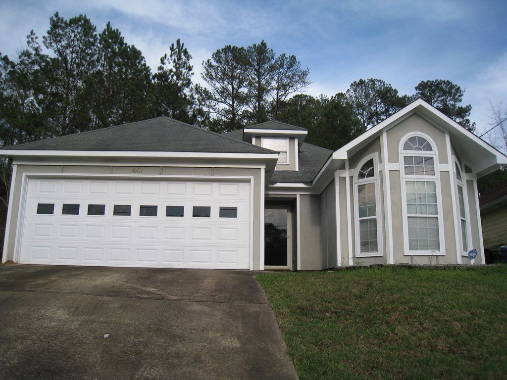 3007 Alamo Court Columbus, GA 31907 - Photo 2 of 24 a front view of a house with a yard