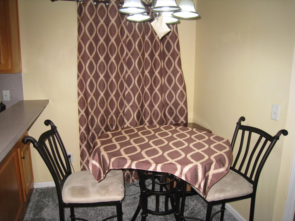 3007 Alamo Court Columbus, GA 31907 - Photo 6 of 24 a view of a dining room with furniture and wooden floor