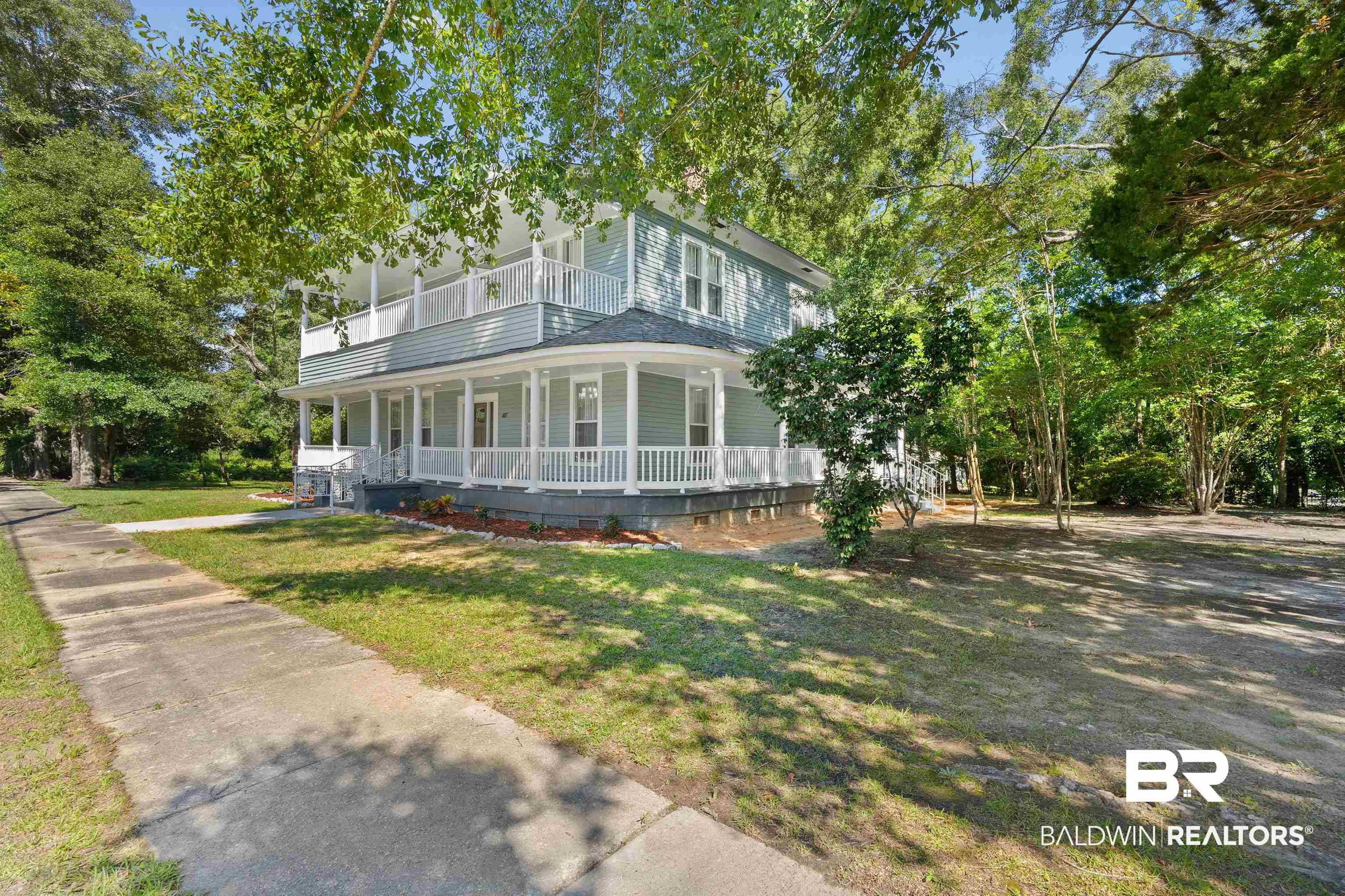 407 East 2nd Street Bay Minette, AL 36507 - Photo 3 of 40 View of front of house featuring covered porch and a front lawn