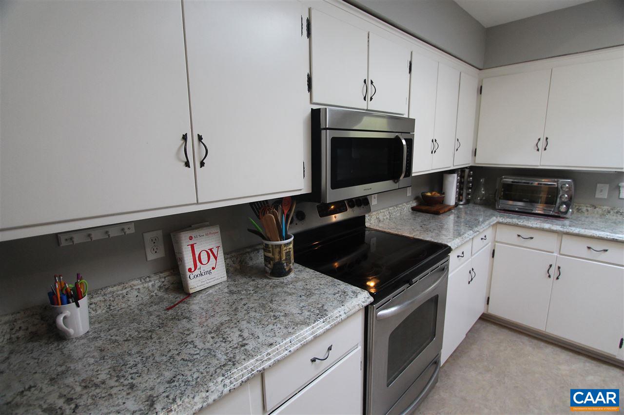 2409 Wakefield Road Charlottesville, VA 22901 - Photo 8 of 35 a kitchen with stainless steel appliances granite countertop a sink stove and cabinets