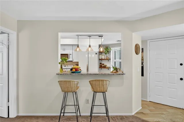 a room with a table and chairs