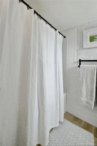 a bathroom with a double vanity sink and mirror