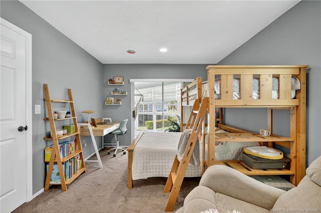 3260 Southeast Aster Lane, Unit I241 Stuart, FL 34994 - Photo 25 of 48 a view of a livingroom with furniture window and outside view