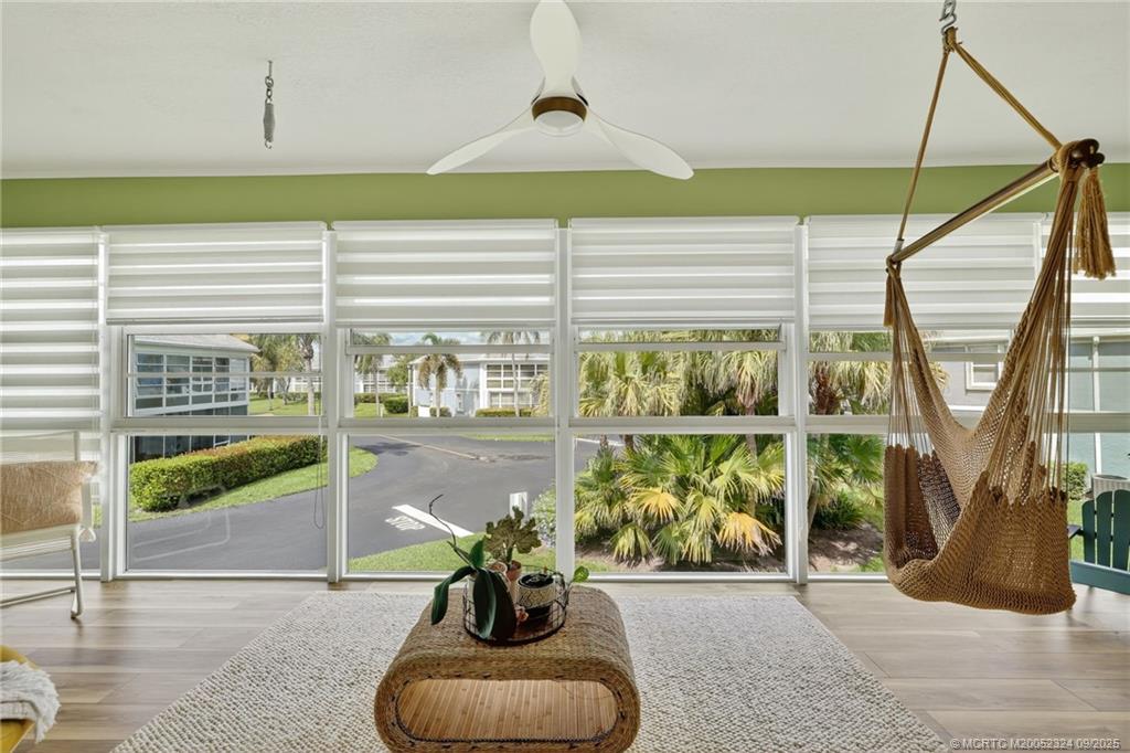 3260 Southeast Aster Lane, Unit I241 Stuart, FL 34994 - Photo 32 of 48 a potted plant sitting on the side of a building