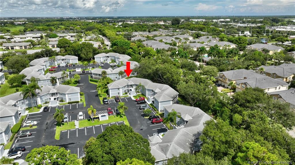 3260 Southeast Aster Lane, Unit I241 Stuart, FL 34994 - Photo 41 of 48 an aerial view of residential houses with outdoor space