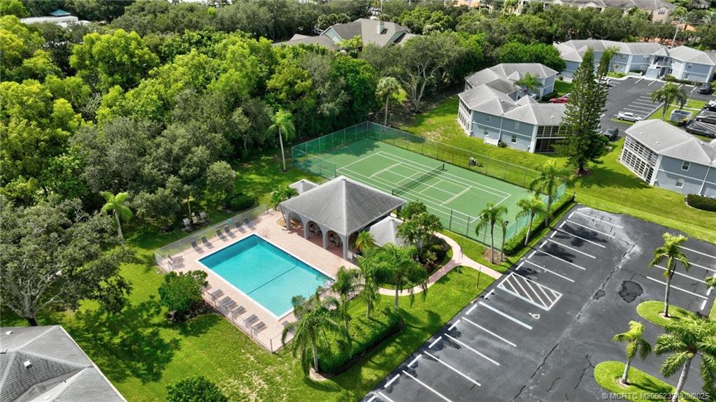 3260 Southeast Aster Lane, Unit I241 Stuart, FL 34994 - Photo 46 of 48 an aerial view of a house with garden space and street view