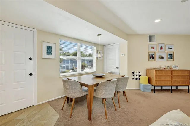 a view of a livingroom with furniture and a window